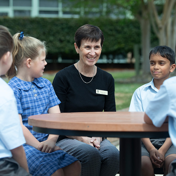 Principal's of St Thomas Aquinas Catholic Primary Springwood with students