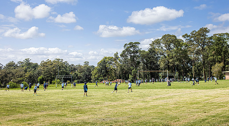 Students playing in the oval at St Thomas Aquinas Catholic Primary Springwood