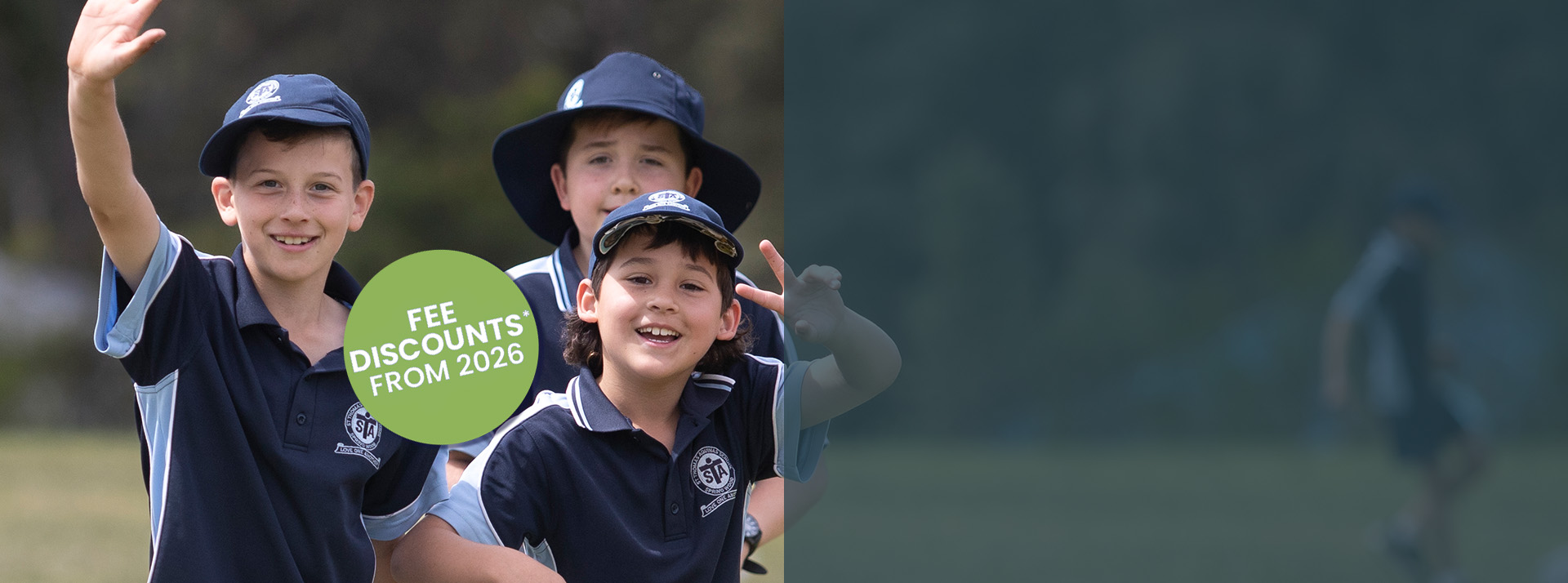 St Thomas Aquinas Catholic Primary School students playing on school field