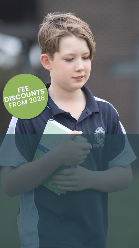 St Thomas Aquinas Catholic Primary School child walking with bible