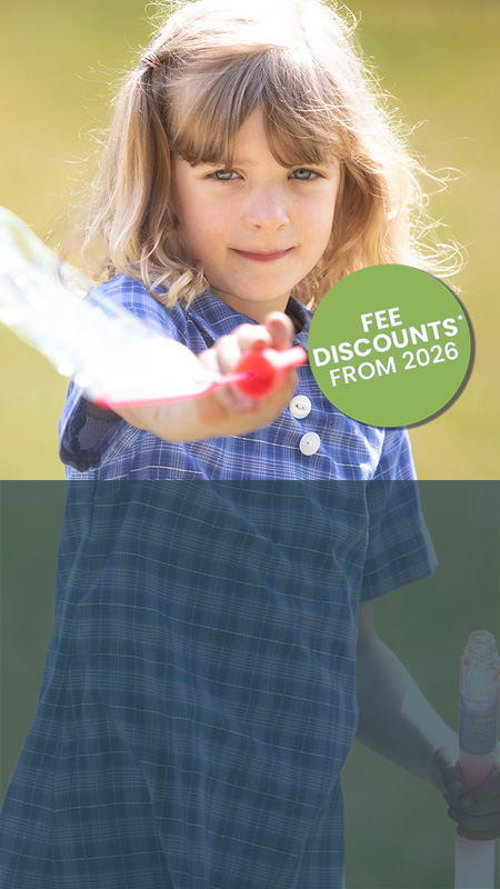 St Thomas Aquinas Catholic Primary School child playing with bubbles