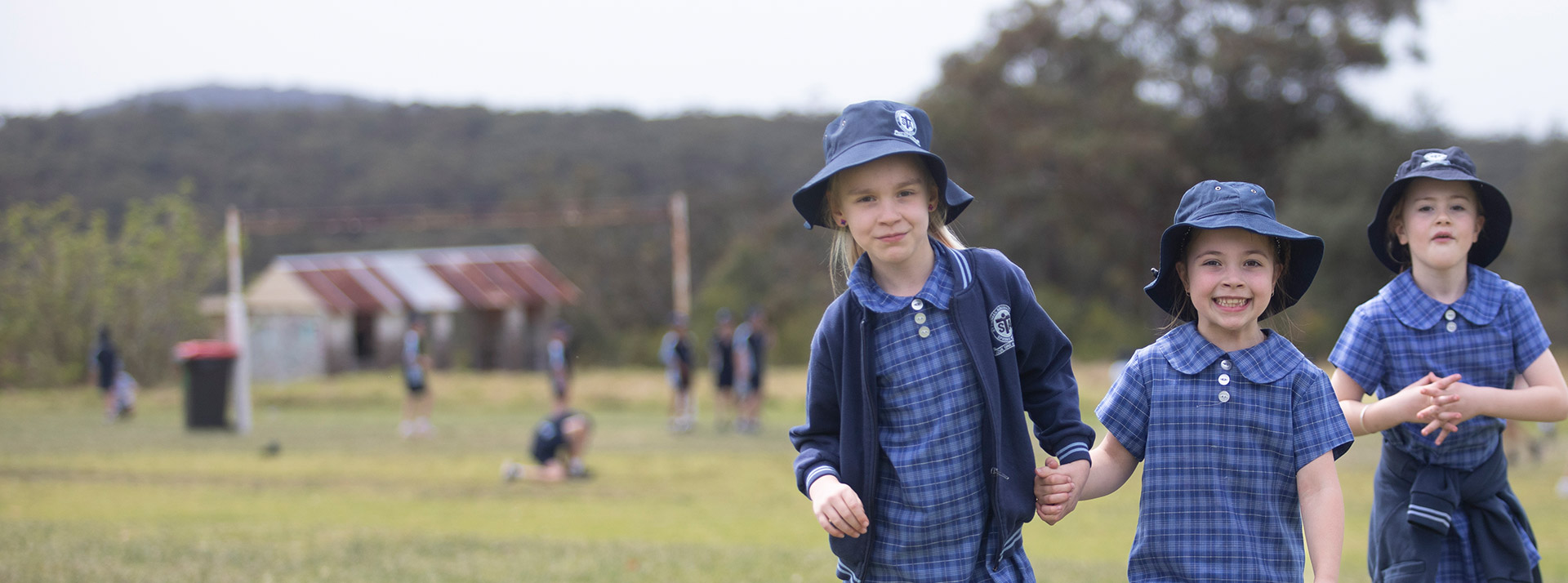Students playing outdoors at  St Thomas Aquinas Catholic Primary Springwood