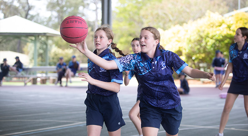 Students playing basketball at St Thomas Aquinas Catholic Primary Springwood