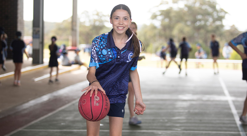 Students from St Thomas Aquinas Catholic Primary Springwood playing basketball