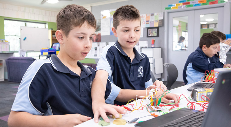 Two St Thomas Aquinas Catholic Primary Springwood using Chromebooks