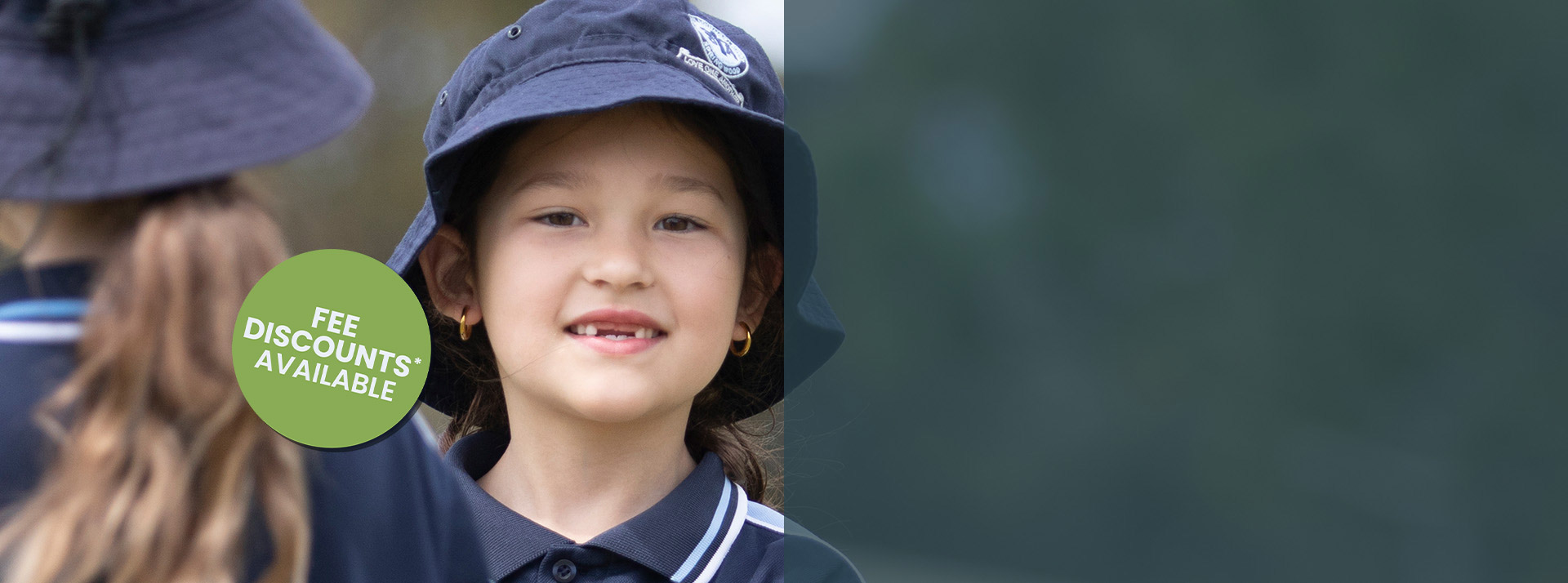 Happy Stage 1 student outdoors at St Thomas Aquinas, Springwood