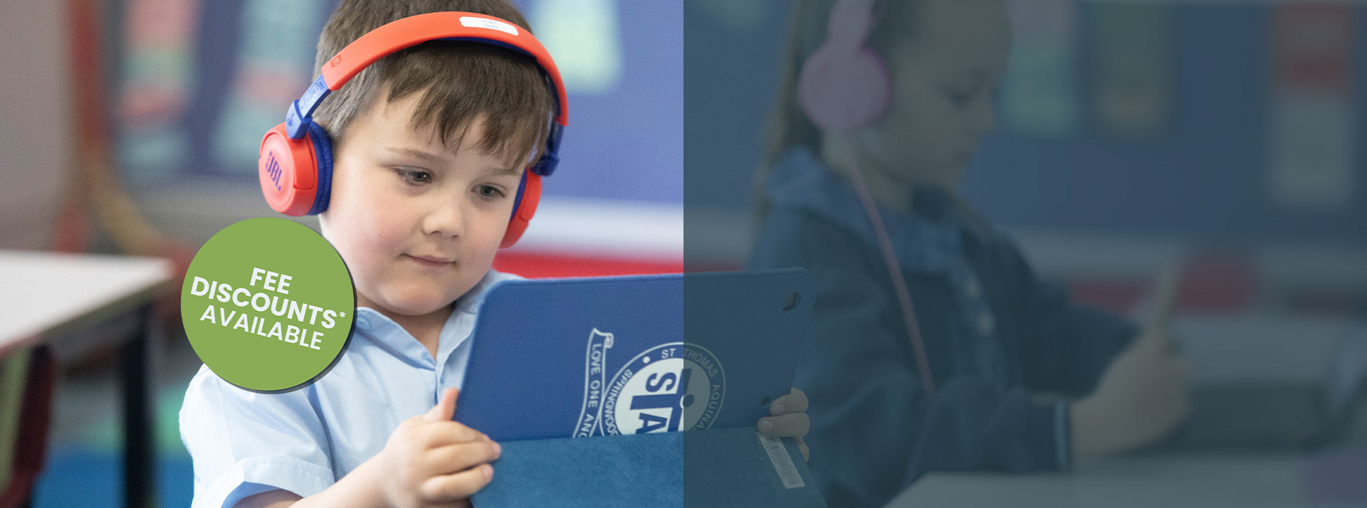 St Thomas Aquinas, Springwood student using iPad and headphones